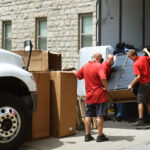 movers unload furniture at Arnold hall